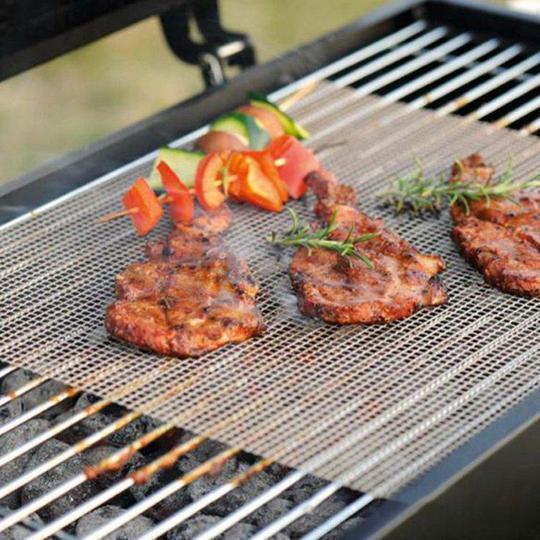Universal non-stick grill mat for BBQ. Reusable, heat resistant, easy clean cooking surface.