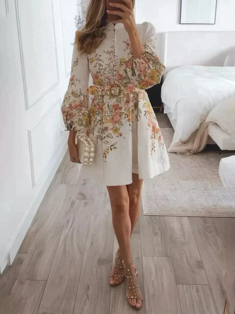Women's chic printed A-line mini dress with V-neck & button front, perfect for summer casual elegance.