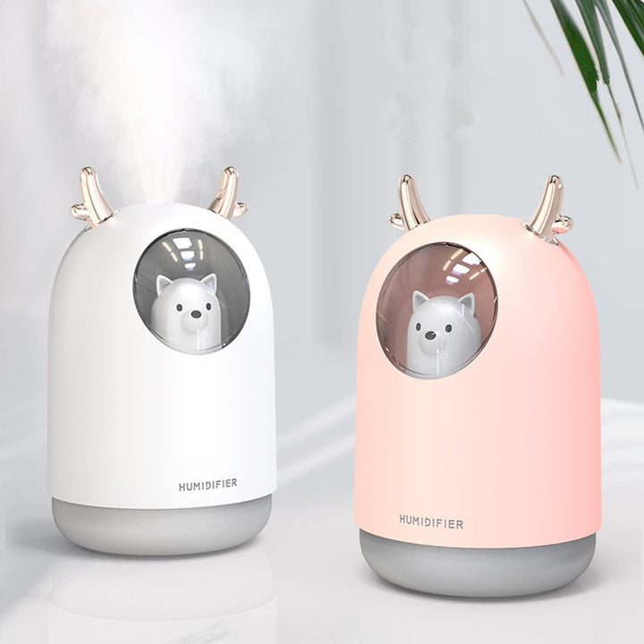 White ultrasonic humidifier with LED night light for baby nursery. Promotes better air quality & peaceful sleep.