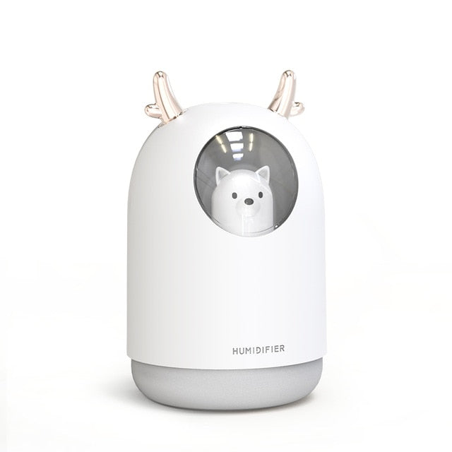 Pink ultrasonic humidifier with soft LED night light, perfect for a baby's room. Quiet operation for health.