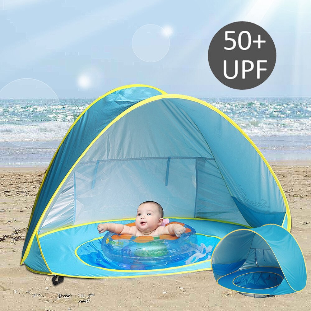 Portable pop-up baby beach tent with UV sun protection, perfect for outdoor play.