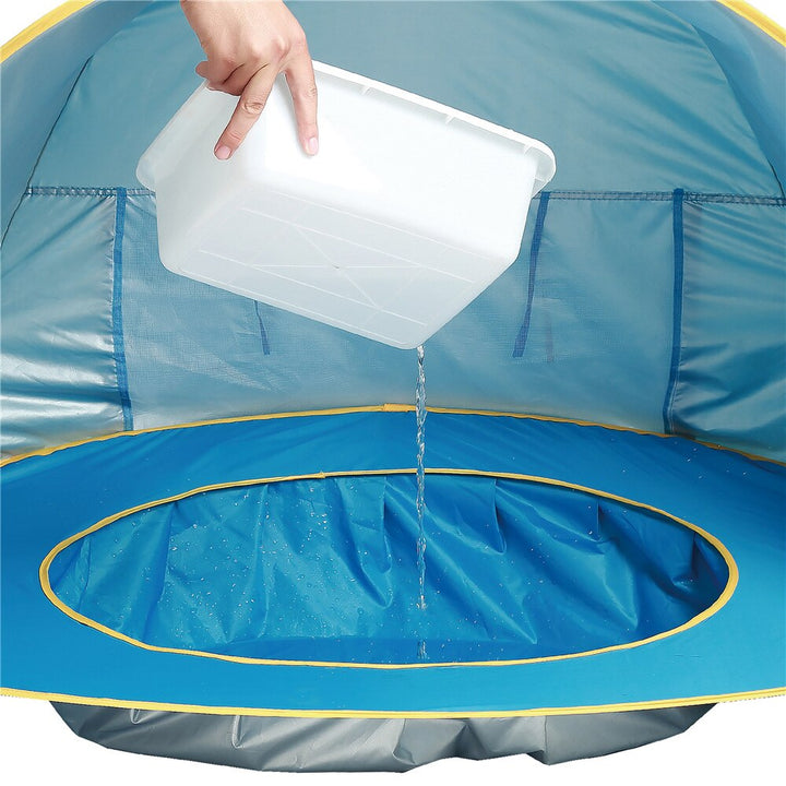 Baby beach shade tent with UV protection, providing a secure and fun mini splash pool.