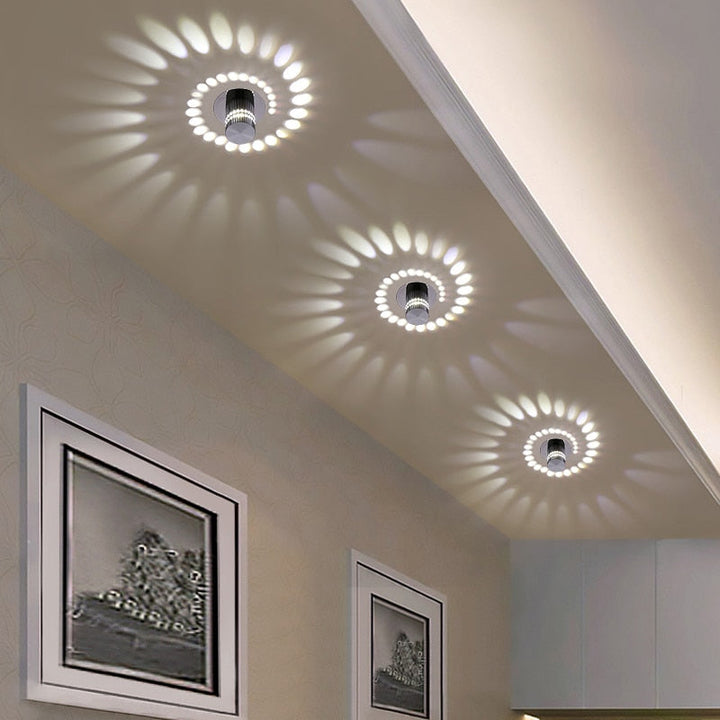 Spiral LED wall & ceiling light fixture by Nvroome. Modern, energy-saving decorative lighting for home ambiance.