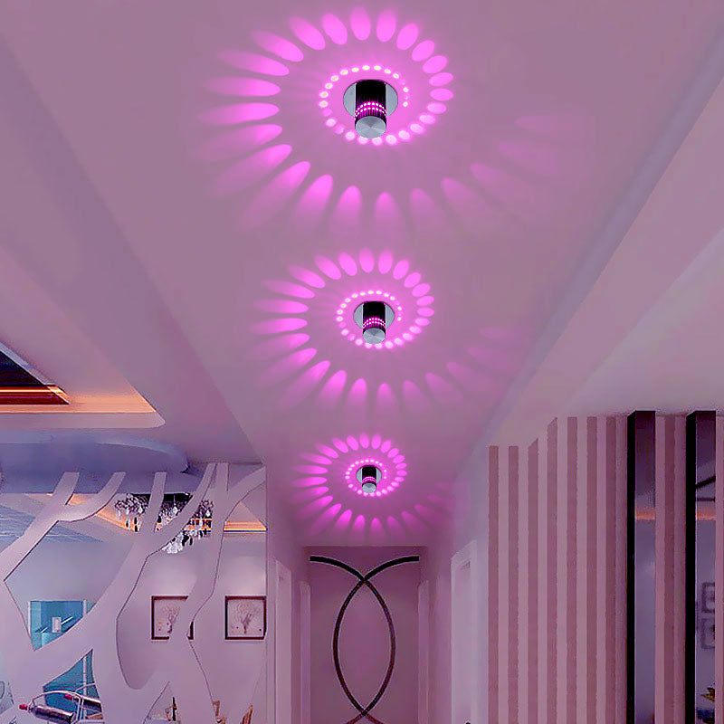 Modern spiral LED wall light fixture, adding decorative ambiance to any room. Energy-efficient home decor.