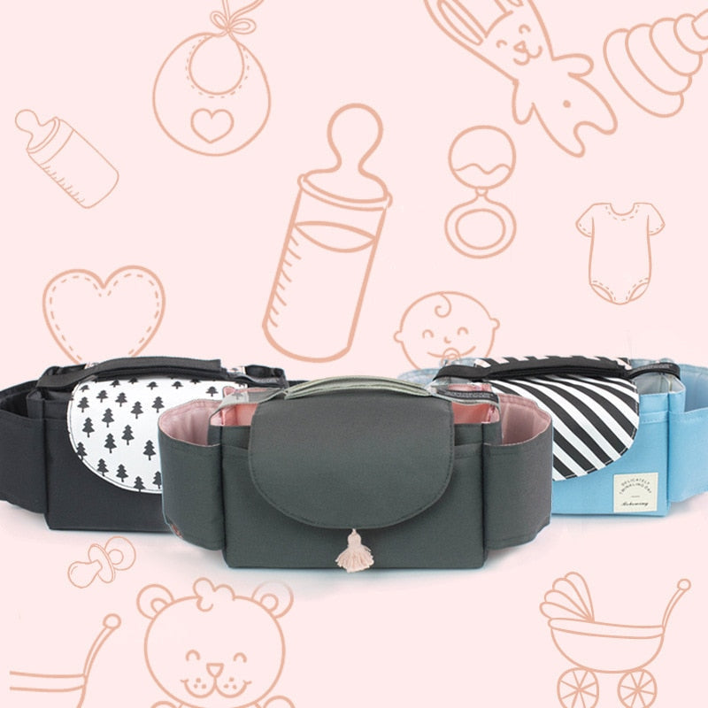 All-year travel organizer for baby essentials, functioning as a waterproof pram bag with adjustable dividers.