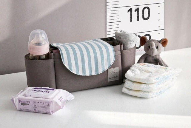 Multifunctional stroller organizer bag for unisex use, with customisable dividers for infant gear.