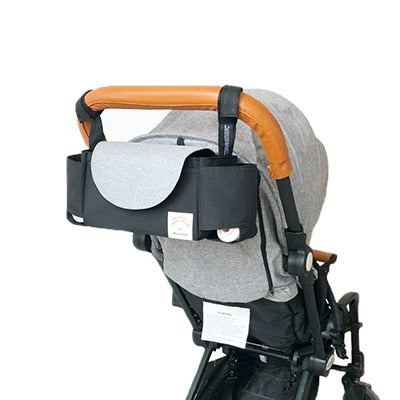 Practical baby organizer bag for strollers, featuring adjustable internal dividers for bottles, wipes & toys.