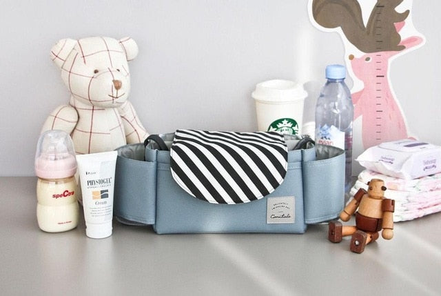 Versatile baby bag for prams, a unisex diaper organizer with flexible dividers for all-year use.