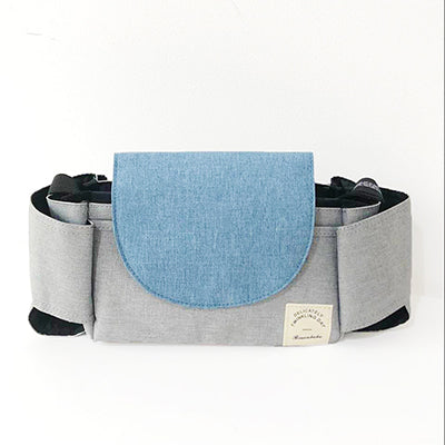 Compact baby essentials travel bag, easily attaching to prams, with adjustable dividers for ultimate organization.