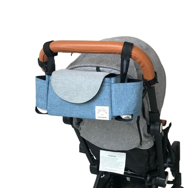 Essential stroller bag & diaper caddy with adjustable sections, providing easy access to baby's needs.