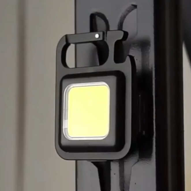 Bright rechargeable LED/COB mini light keychain, with integrated multi-tool. Convenient portable flashlight.