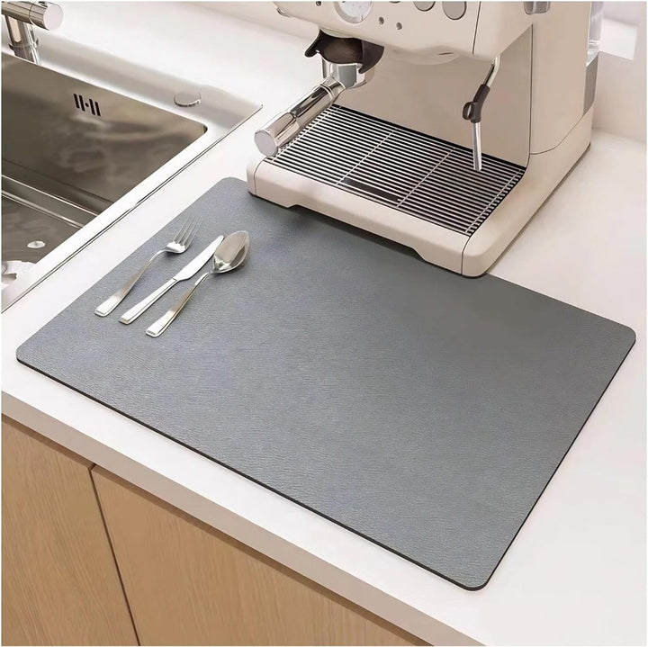 Modern diatomite dish mat for kitchen counters. Super absorbent & quick-drying for plates, cups, cutlery.