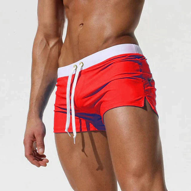 Essential men's quick-dry beach shorts with an adjustable drawstring, ideal for active summer days.