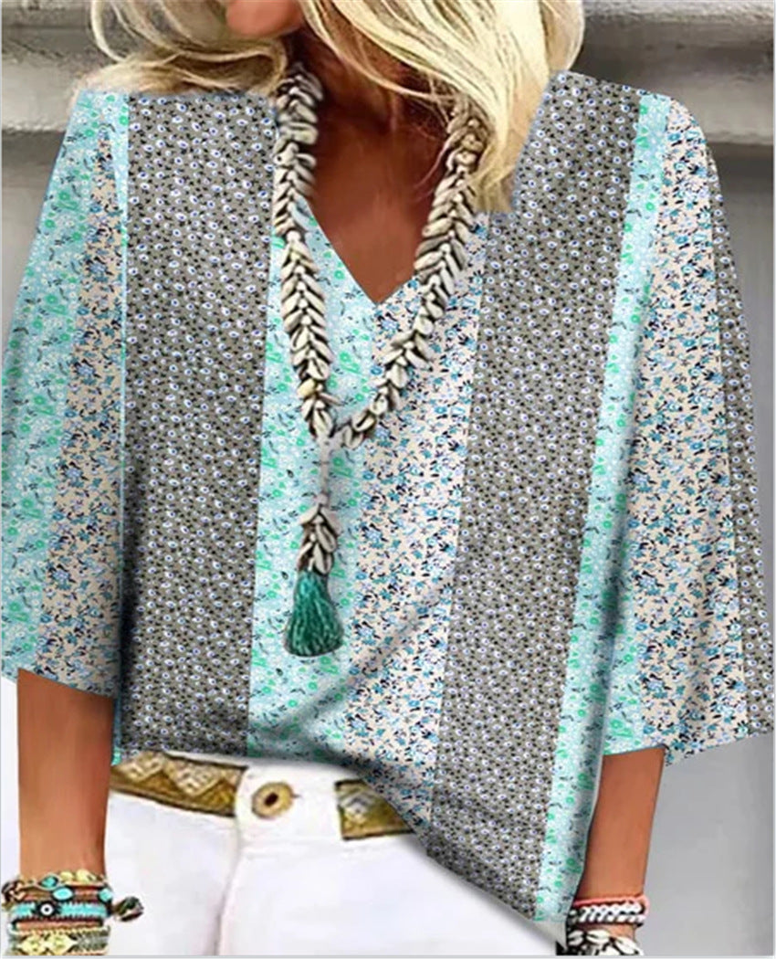 Close-up of elegant women's floral print blouse fabric, showcasing vibrant pattern & soft texture. Ideal for daily wear.