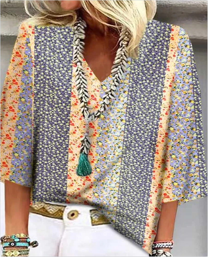 Model wearing versatile women's floral print V-neck blouse with relaxed fit & 3/4 sleeves, styled for summer fashion.