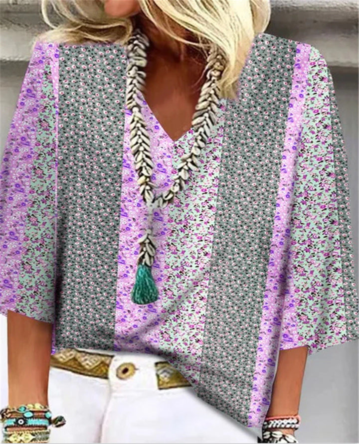 Back view of women's relaxed fit floral print blouse with V-neck, showcasing its comfortable & elegant daily wear style.