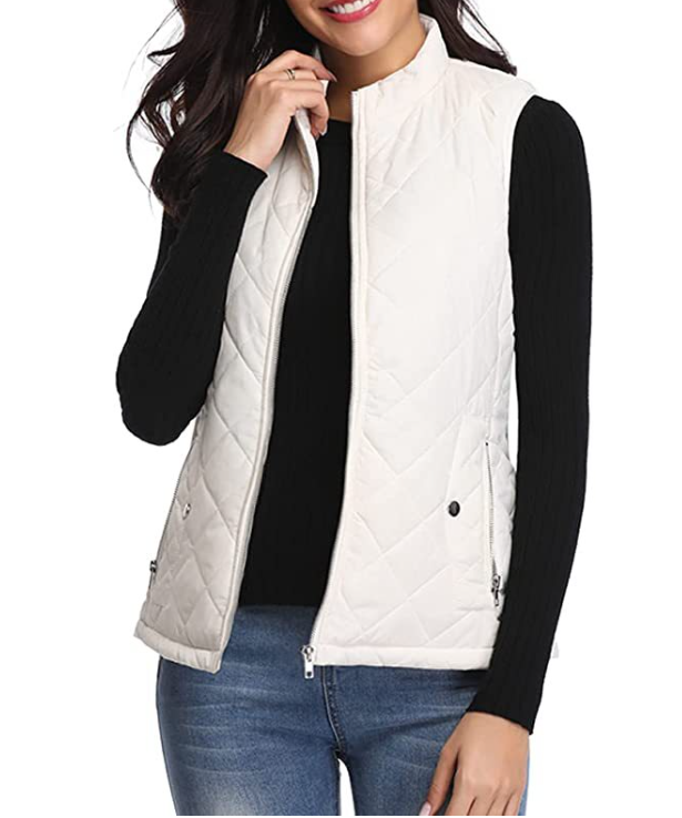 Sleeveless quilted vest for women, featuring a zip front, ideal for transitional layering.