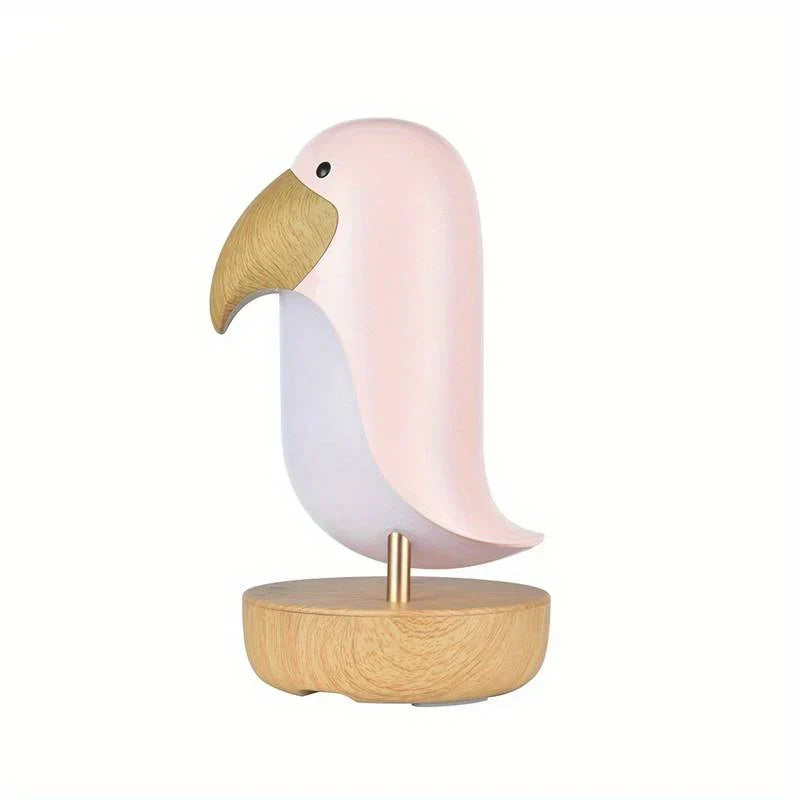 Charming PeckLight bird table lamp, a rechargeable decorative nightlight offering warm, portable ambient lighting.