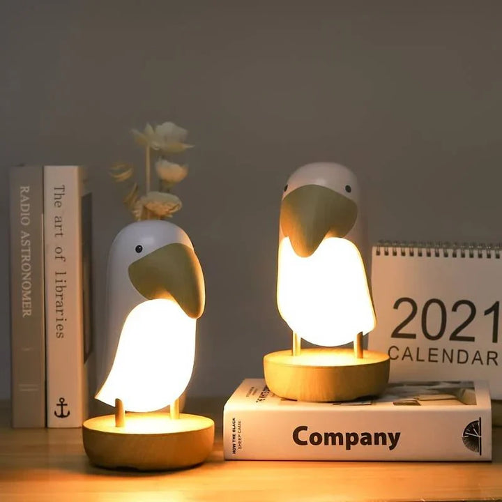 Decorative PeckLight rechargeable bird nightlight, a wireless ambient table lamp with unique woodpecker design.