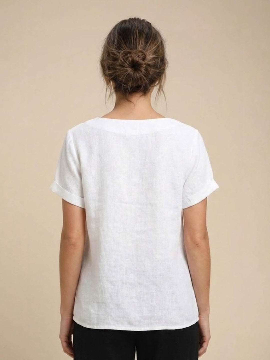 Versatile women's casual tee with scoop neck, short sleeves, and elegant buttons.