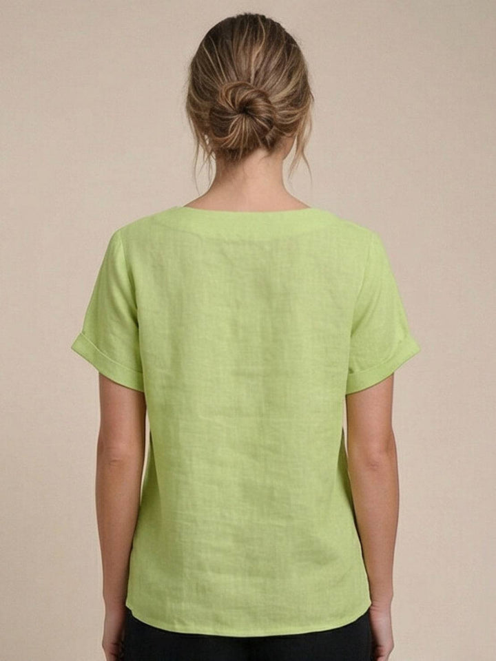 Versatile women's short sleeve top, scoop neck, button detail, great for layering.