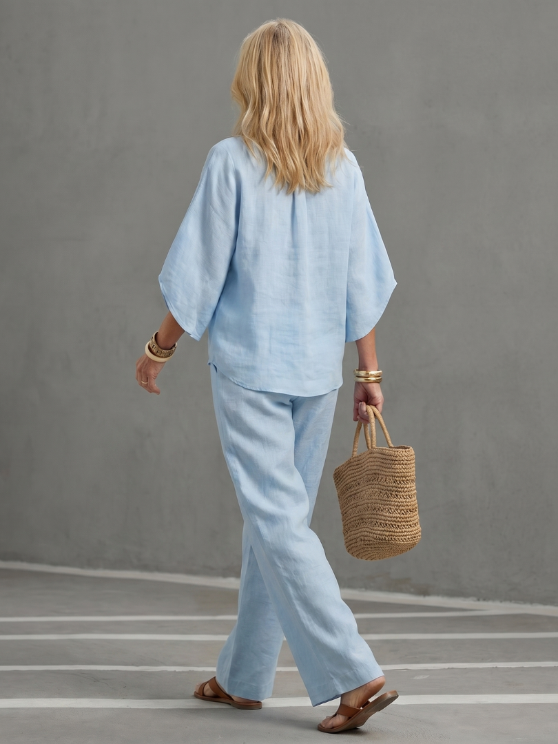 Women's casual two-piece leisure set, relaxed fit with stand collar, wide sleeves, and straight leg pants.