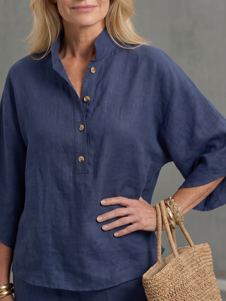 Relaxed fit women's two-piece set featuring a stand collar, wide sleeves, and straight leg pants, comfy loungewear.
