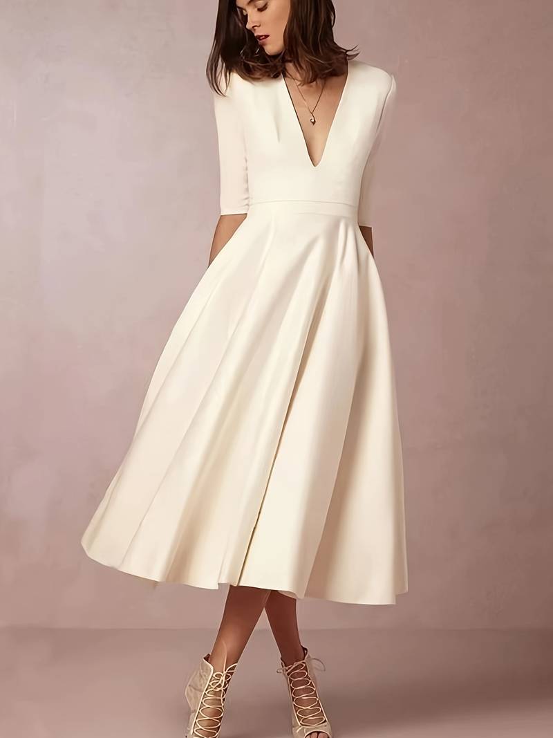 White A-line swing dress for women, embodying 60s fashion with a retro style, ideal for elegant party wear.