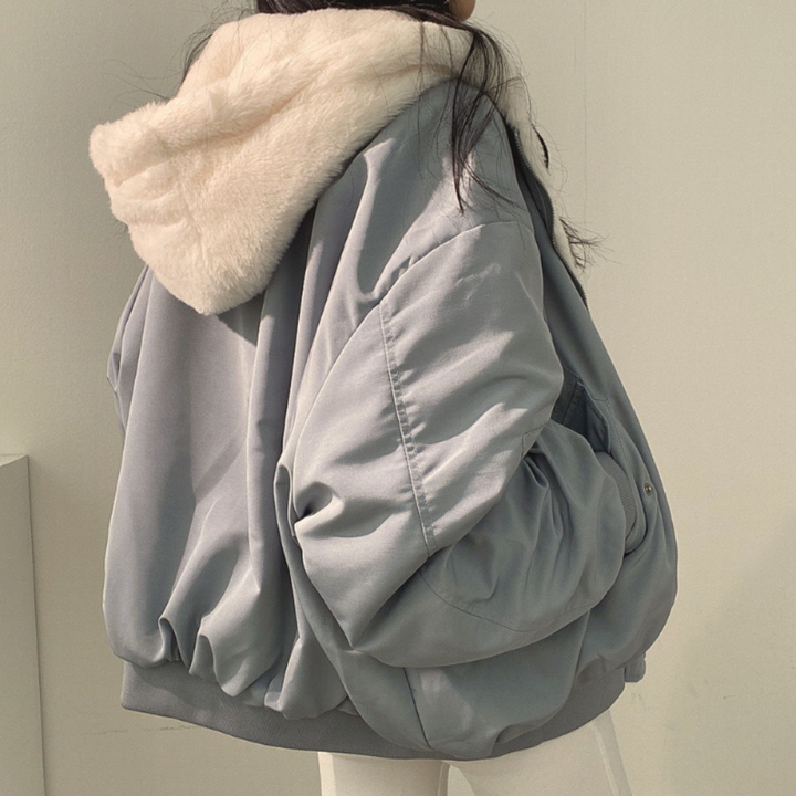 Ladies hooded jacket, showing reverse side, versatile fashion for travel and winter warmth.