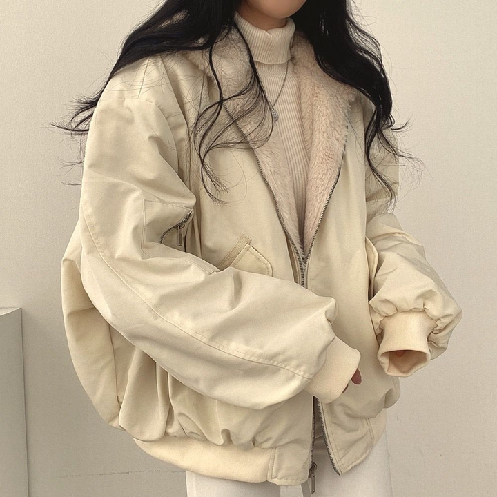 Front view of women's Isla reversible hooded winter jacket, showcasing design & versatility.