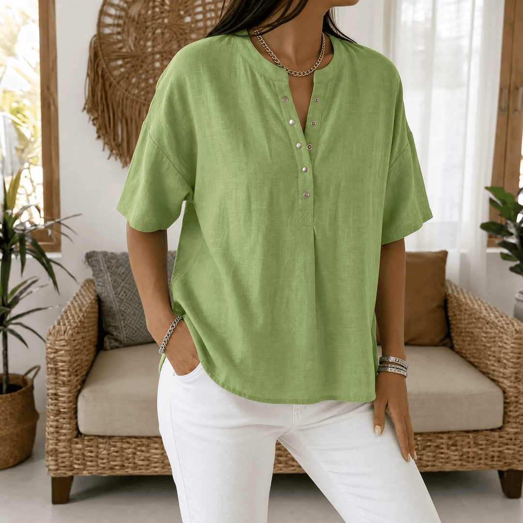 Cream relaxed fit Henley blouse, a versatile women's top perfect for comfortable summer days.