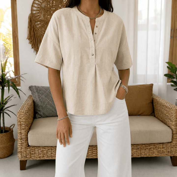 Versatile sage green women's Henley blouse, a relaxed fit top for effortless everyday style.