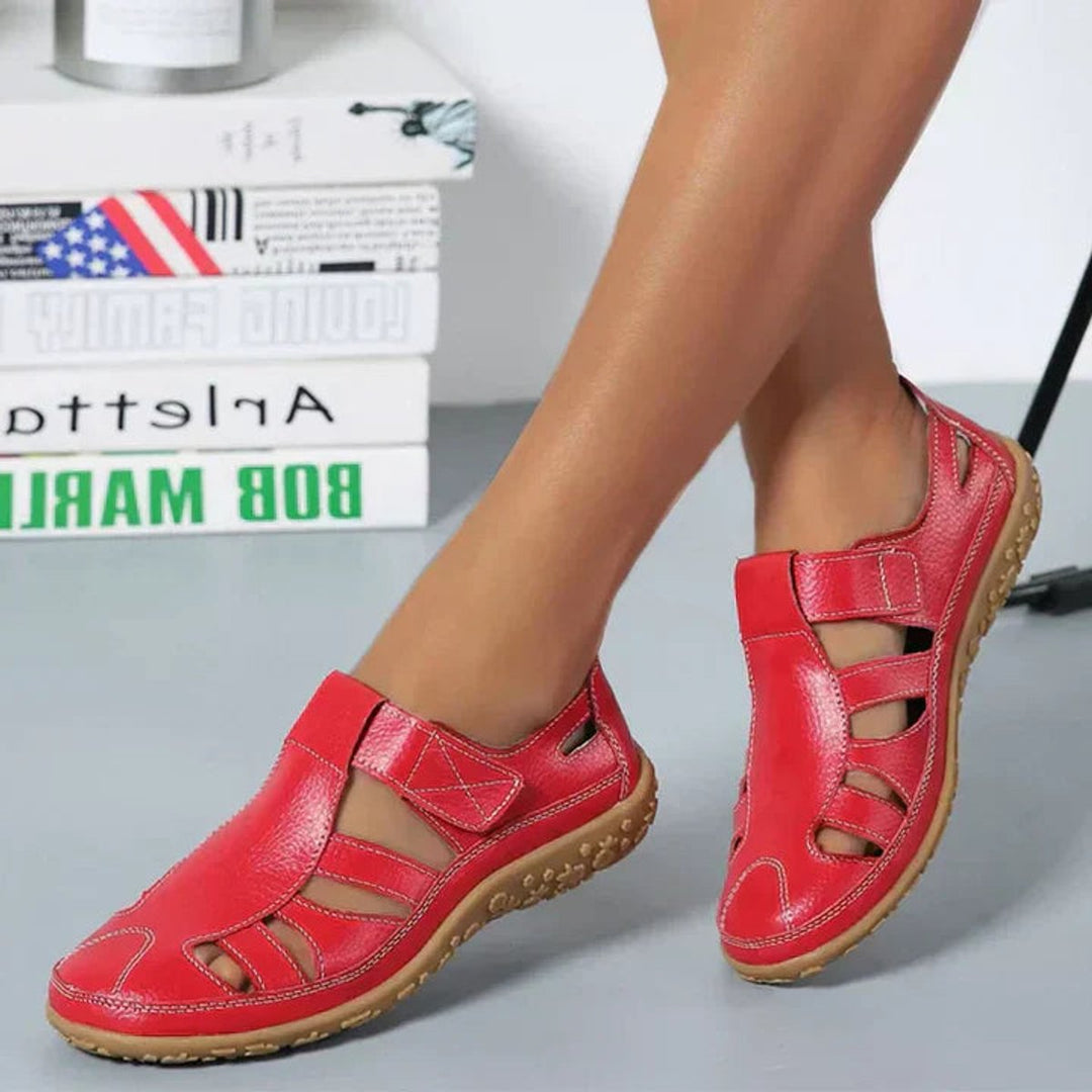 Side view of women's sophisticated closed-toe orthopedic shoes, with arch support & adjustable strap.
