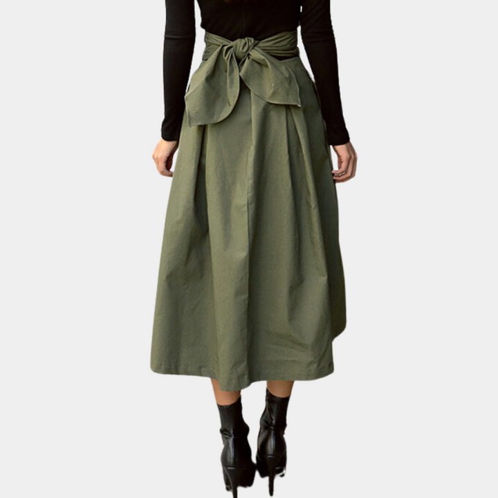 Effortless women's pleated A-line midi skirt with a flattering high-waisted design for versatile styling.