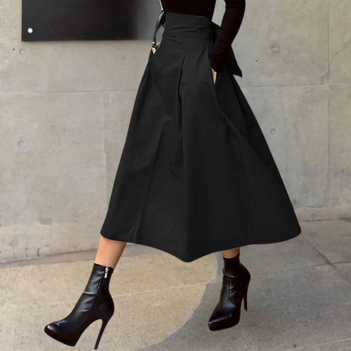 Flowy women's high-waisted pleated A-line midi skirt, an elegant and comfortable choice for any occasion.
