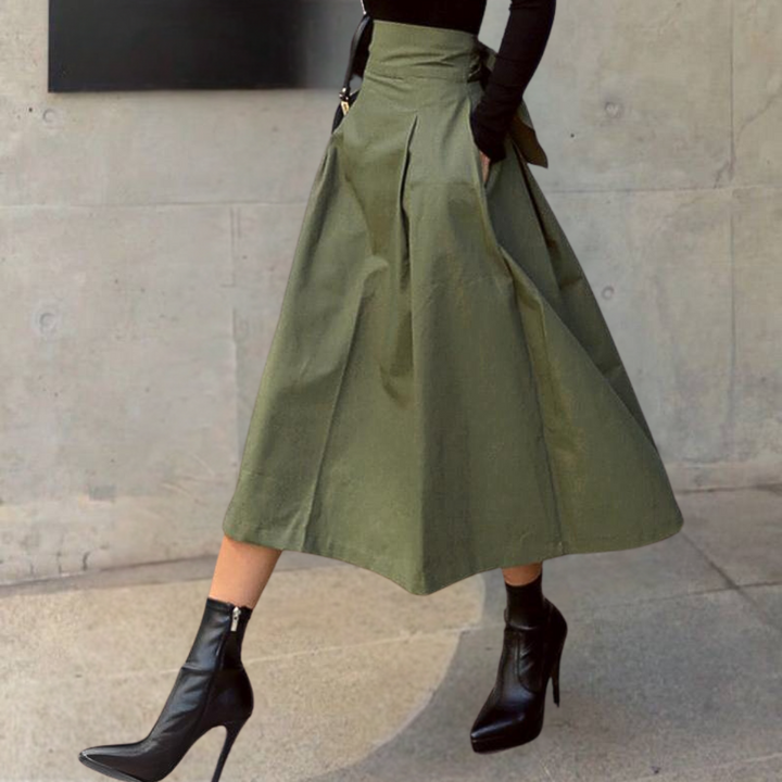 Chic women's high-waisted pleated A-line midi skirt, designed for effortless elegance and a flattering silhouette.