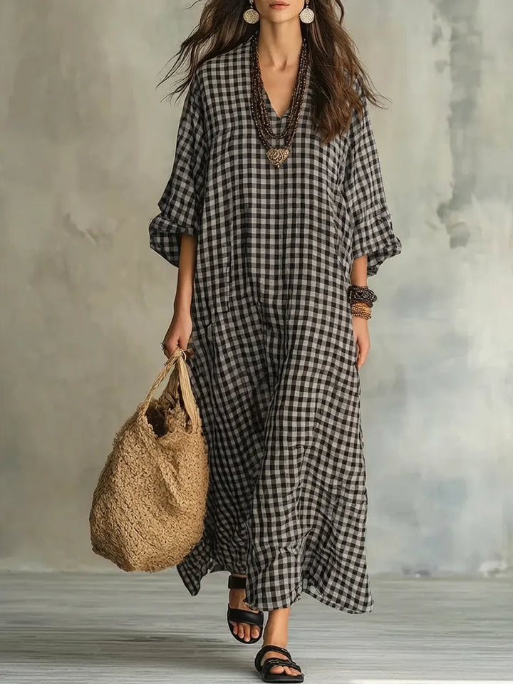 Comfortable women's patterned maxi dress in gingham; oversized, flowy, V-neck, bishop sleeves for summer style.