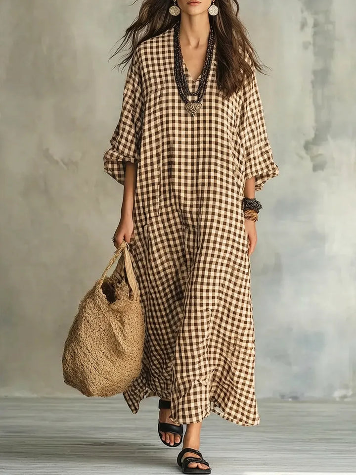 Gingham print women's maxi dress; oversized, comfortable & flowy, featuring a stylish V-neck & bishop sleeves.