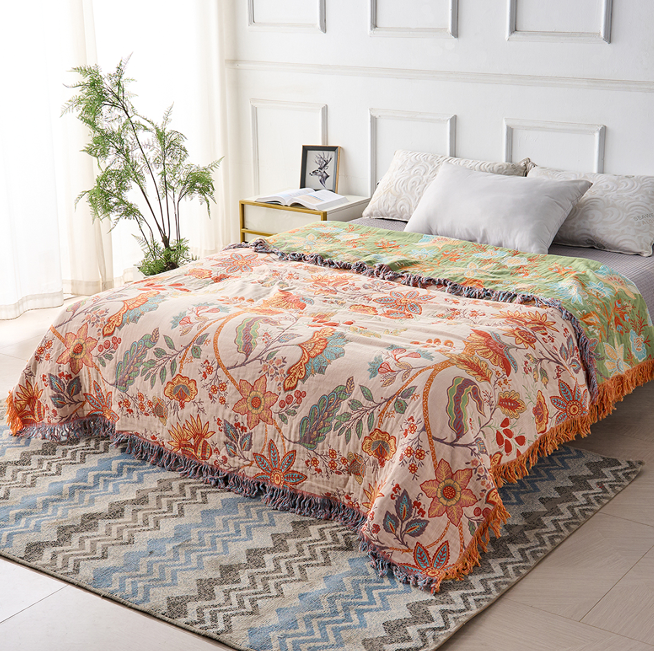 Cozy cotton throw blanket with a beautiful boho floral design. Perfect decorative piece for any home.