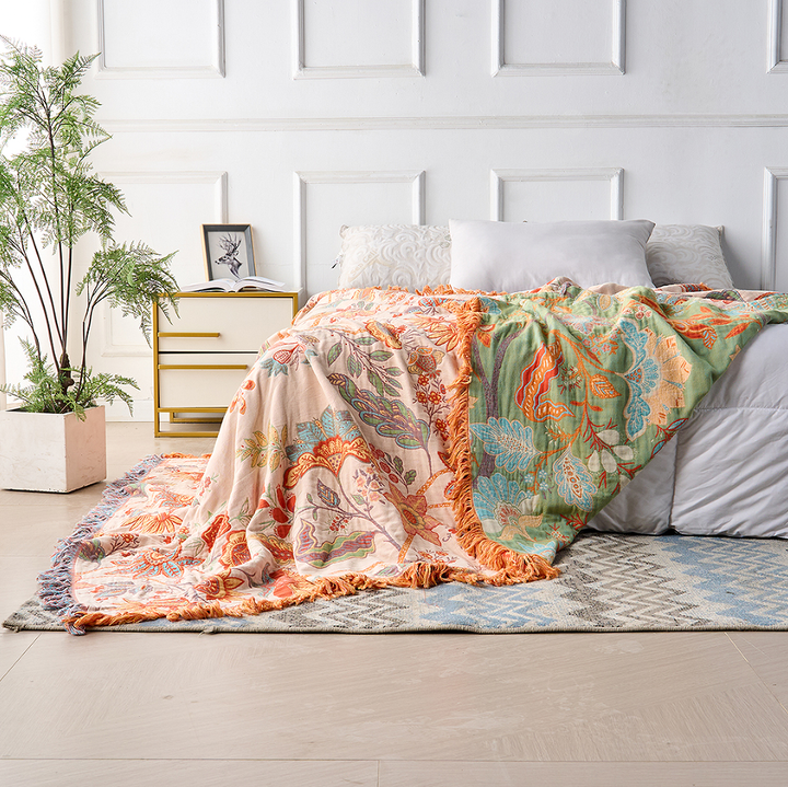 Bohemian floral cotton throw blanket. Versatile decorative accent for rustic home decor or a cozy gift.