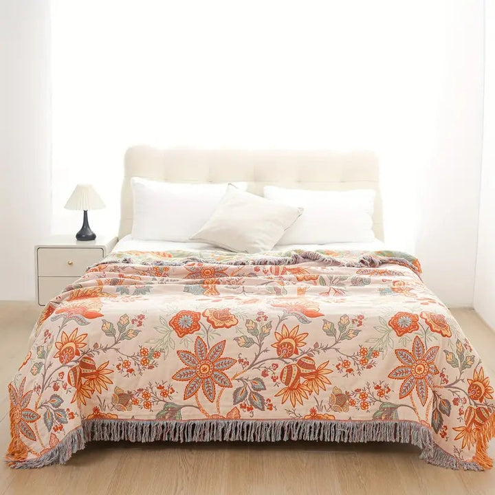 Chic floral cotton throw blanket, a cozy and decorative bohemian gift idea for stylish home decor.