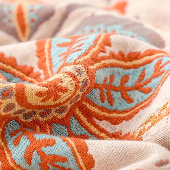 Soft cotton floral blanket, an elegant bohemian throw perfect for adding warmth to home decor.