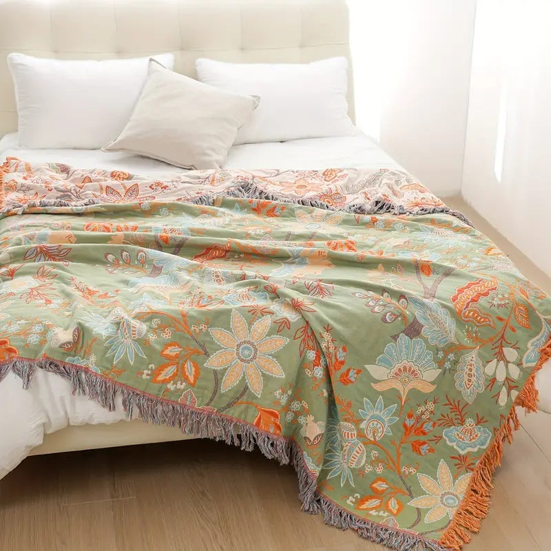 Beautiful, vibrant boho floral cotton throw blanket. A decorative and cozy accent for rustic home decor.