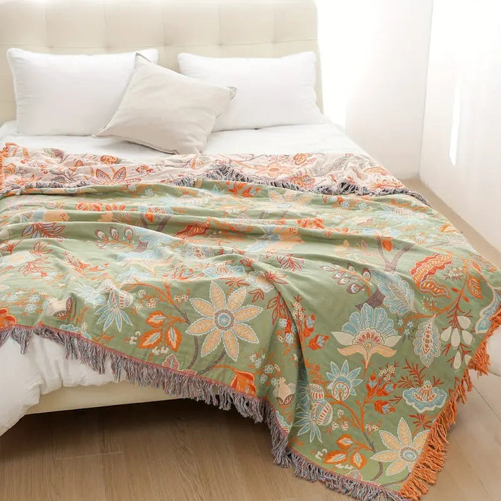 Beautiful, vibrant boho floral cotton throw blanket. A decorative and cozy accent for rustic home decor.