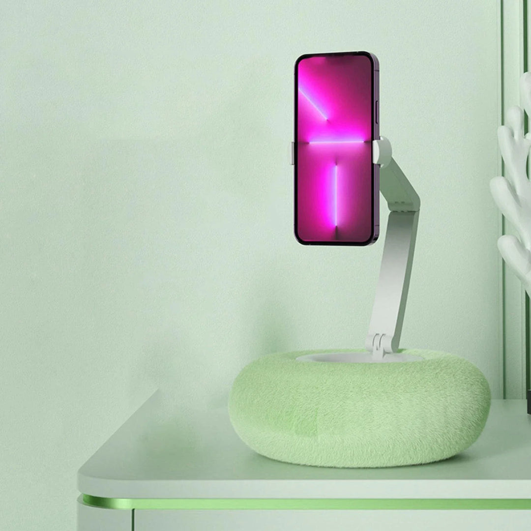 Hands-free phone holder pillow stand, compatible with phones & tablets. Ideal for comfortable multimedia viewing.