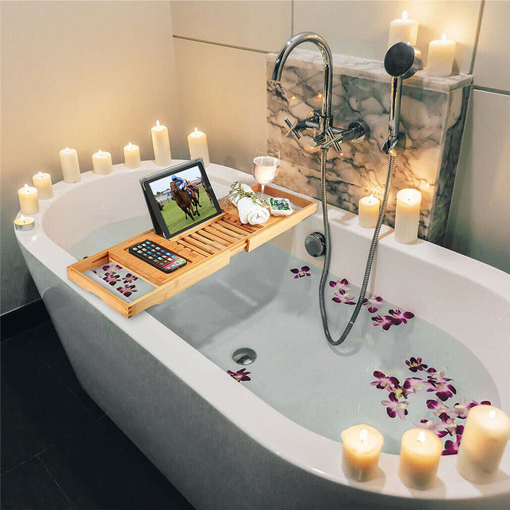 Durable bamboo bath caddy with adjustable sides, enhancing any bath for a relaxing, organized experience.