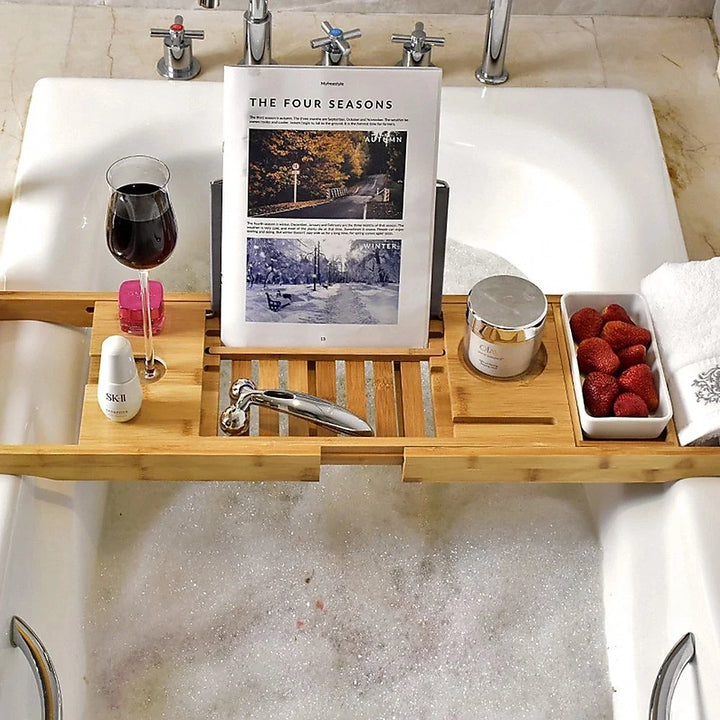 Natural bamboo bath tray caddy offers spa-like relaxation, perfect for organizing bath essentials.