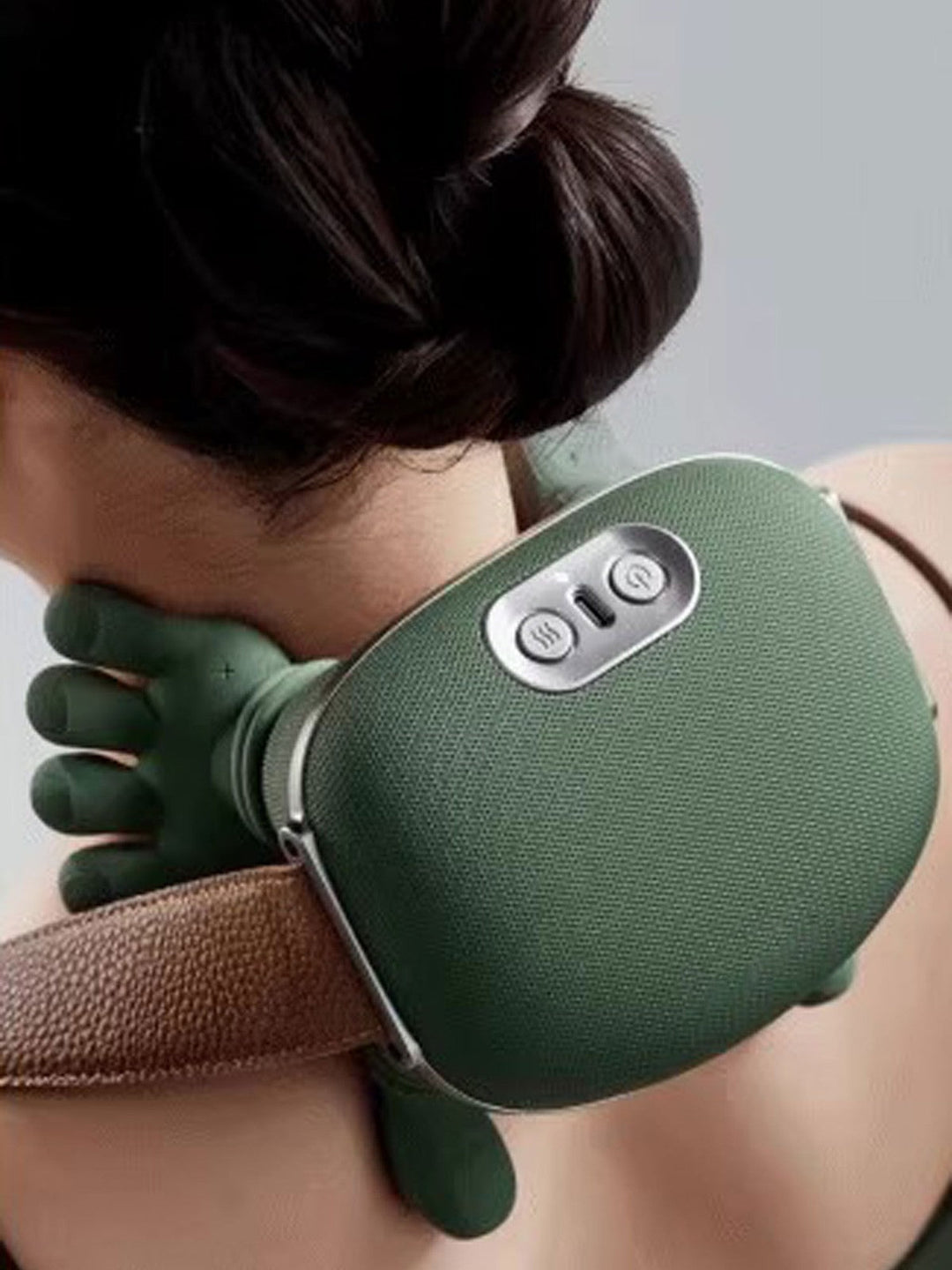 Deep kneading nodes on a unisex shiatsu neck and shoulder massager with soothing heat.