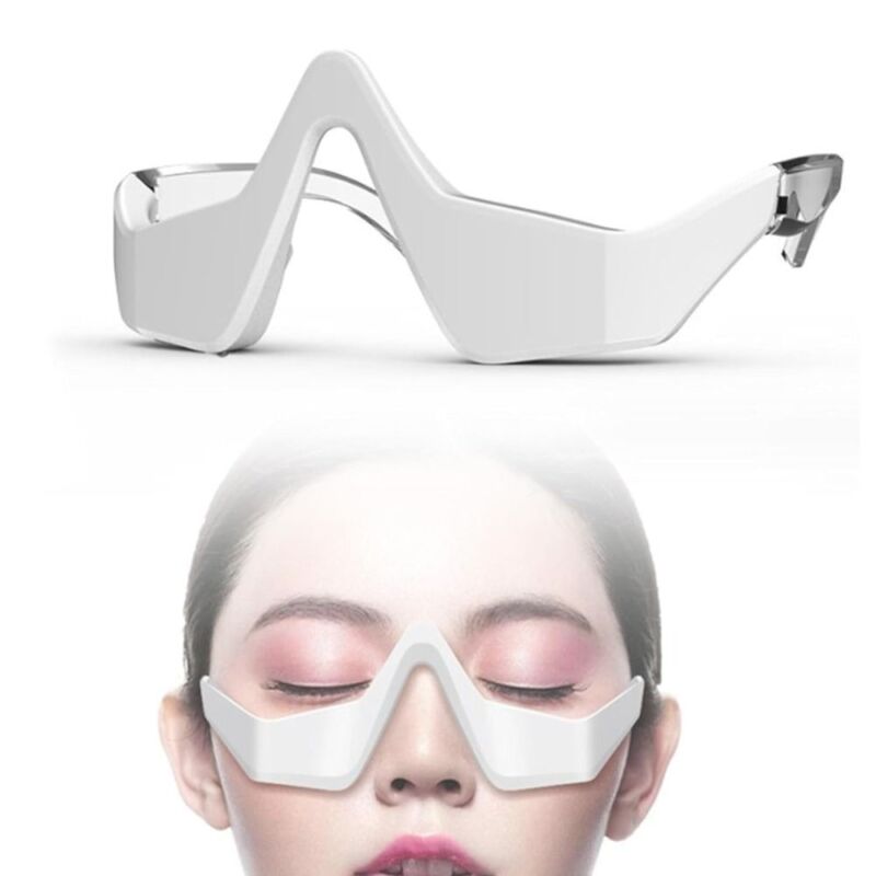Compact under eye massager for daily eye care, combating puffiness & dark circles.
