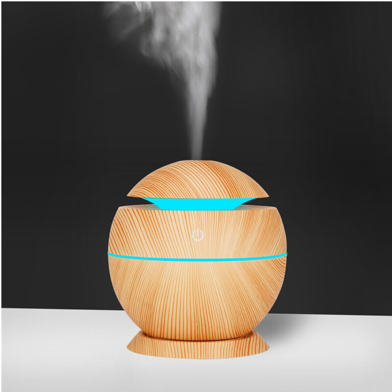 Stylish wood grain essential oil diffuser, compact for modern home decor & wellness.
